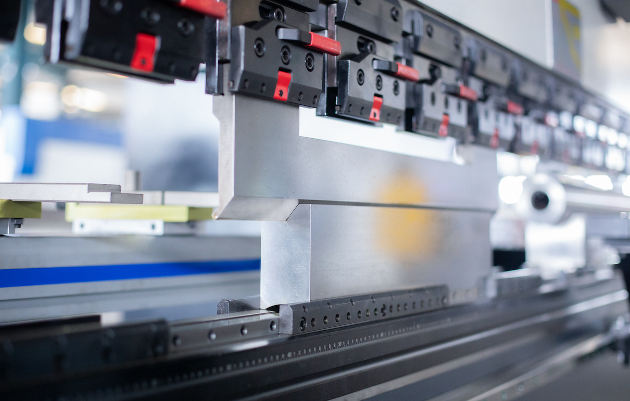 CNC press brake with segmented punch tooling forming sheet metal